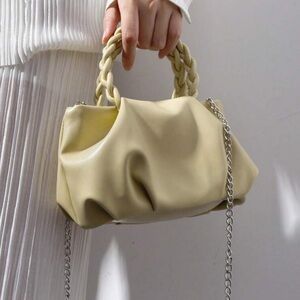 Pleated creamy yellow bag